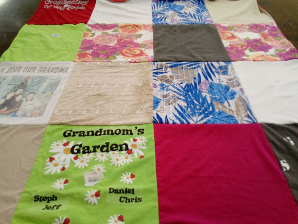 T-shirt quilt with family, gardening themes by Stephanie from NJ
