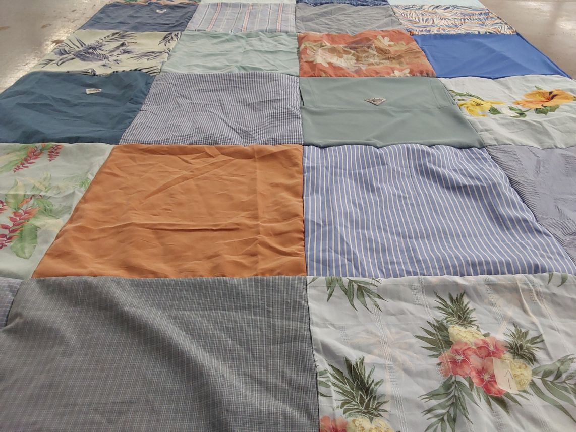 T-shirt quilt with quilting themes by Kaye from FL