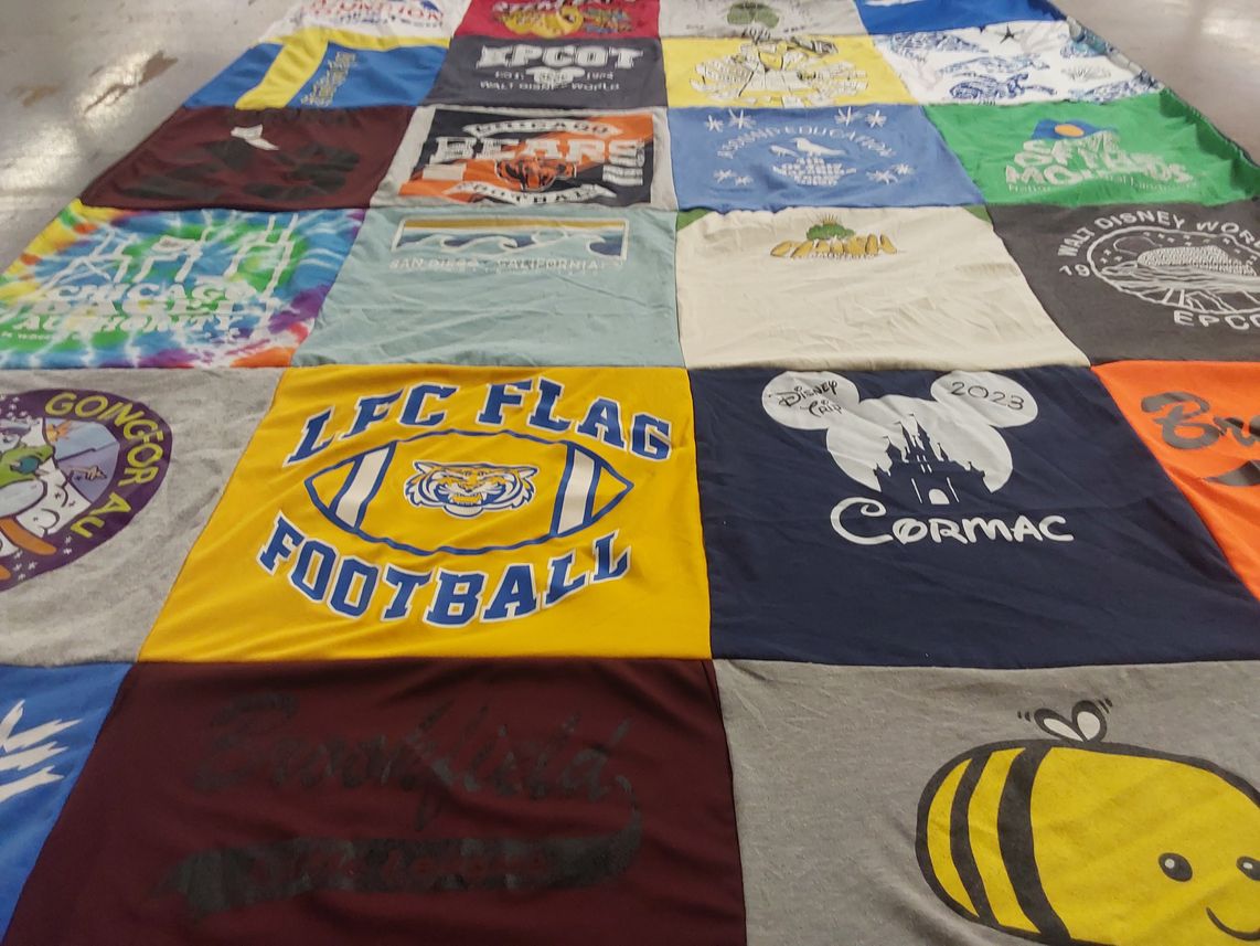 T-shirt quilt with disney, football themes by Virginia from IL