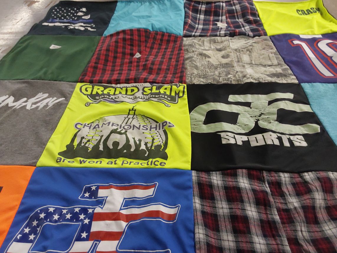 T-shirt quilt with sports themes by JANE from LA