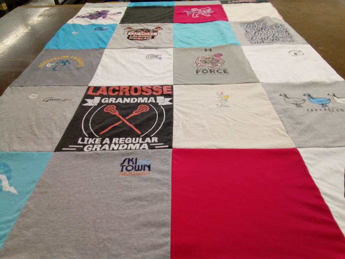 T-shirt quilt with lacrosse, skiing themes by Debbie from UT
