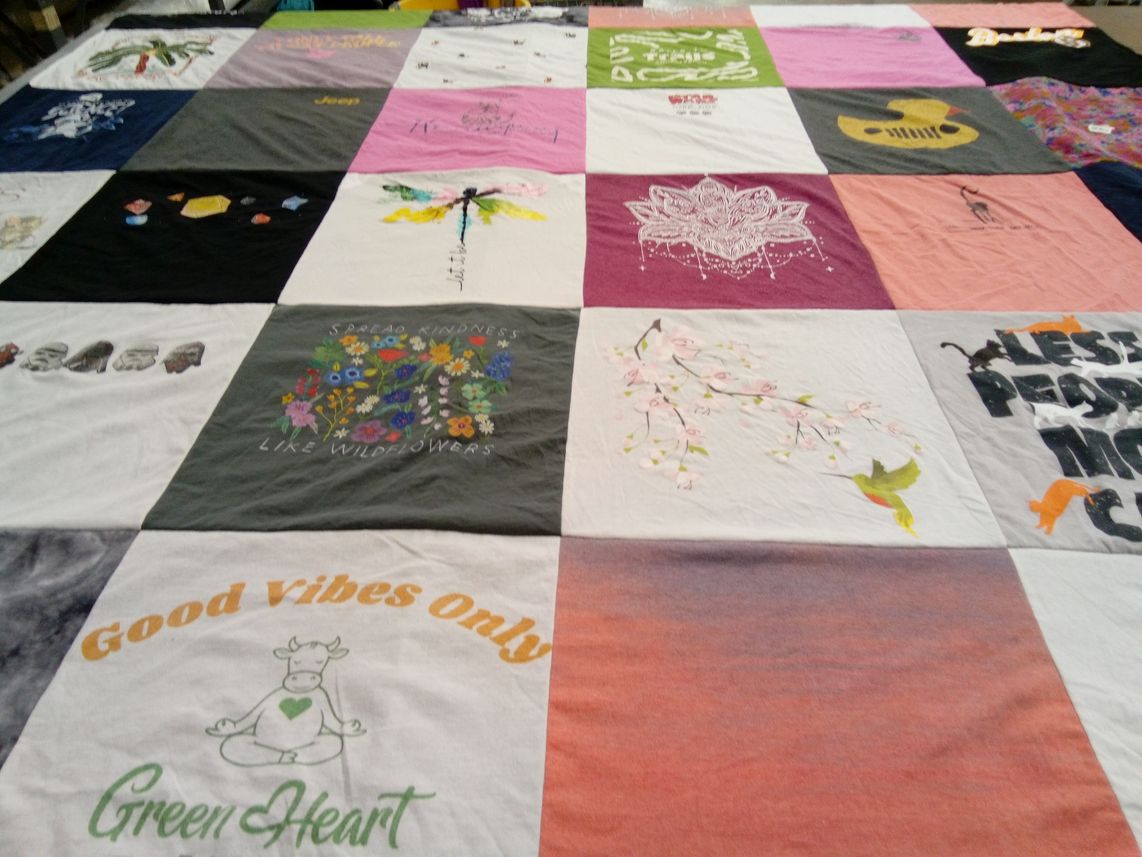 T-shirt quilt with art, kindness themes by Christine from FL