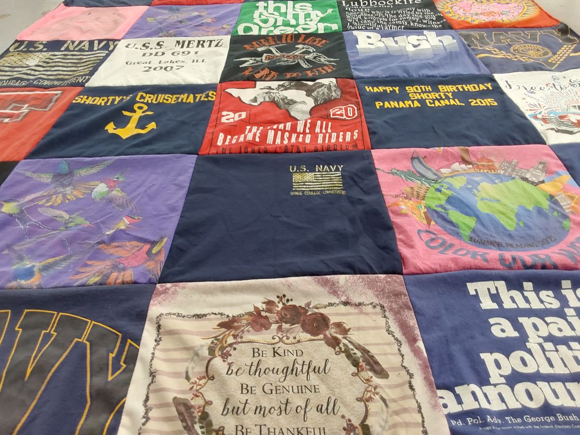 T-shirt quilt with military, celebration themes by Pam from TX