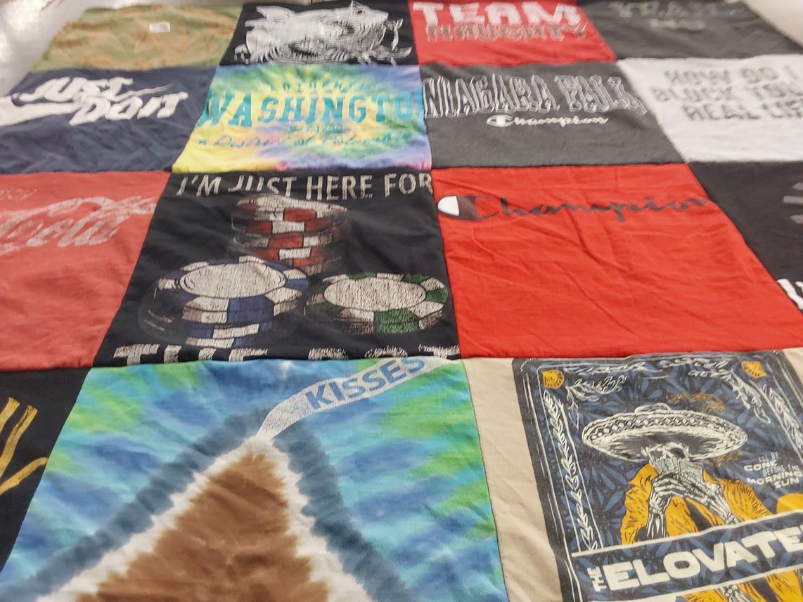 T-shirt quilt with cooking, travel themes by Melissa from MA