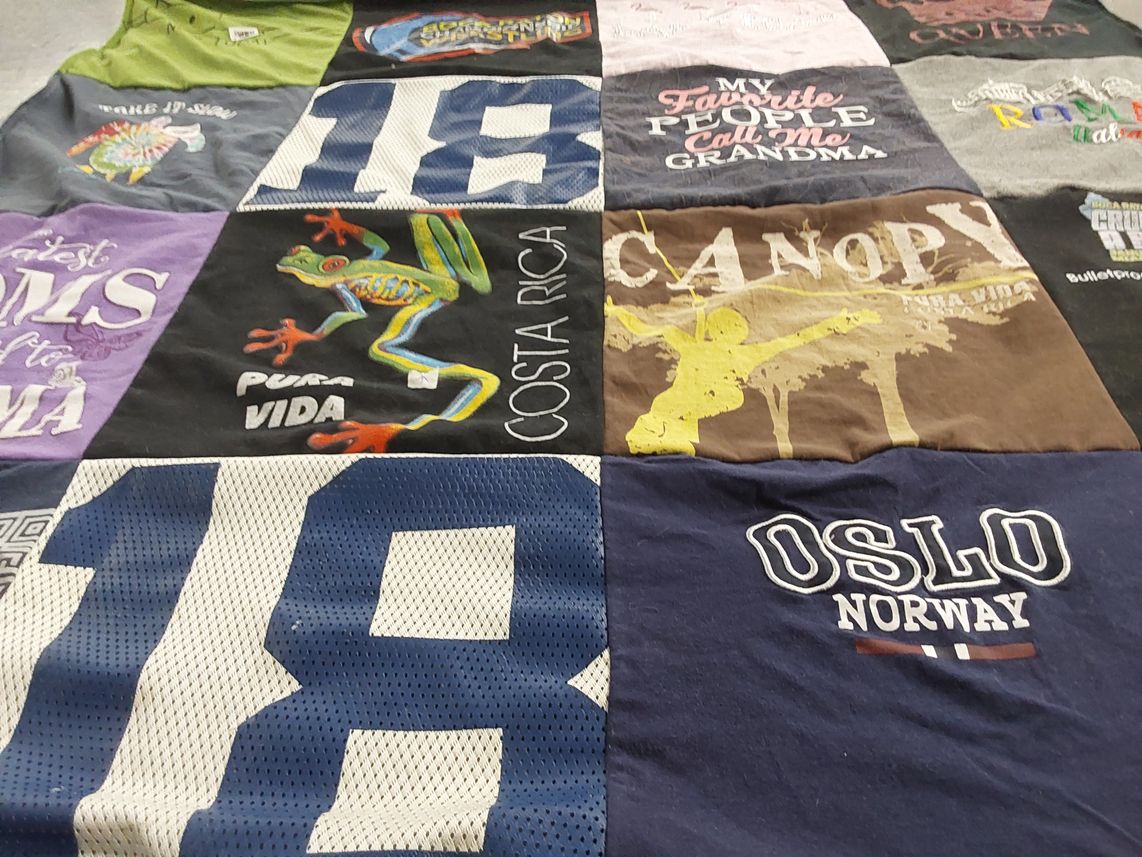 T-shirt quilt with travel, family themes by Ellen from FL