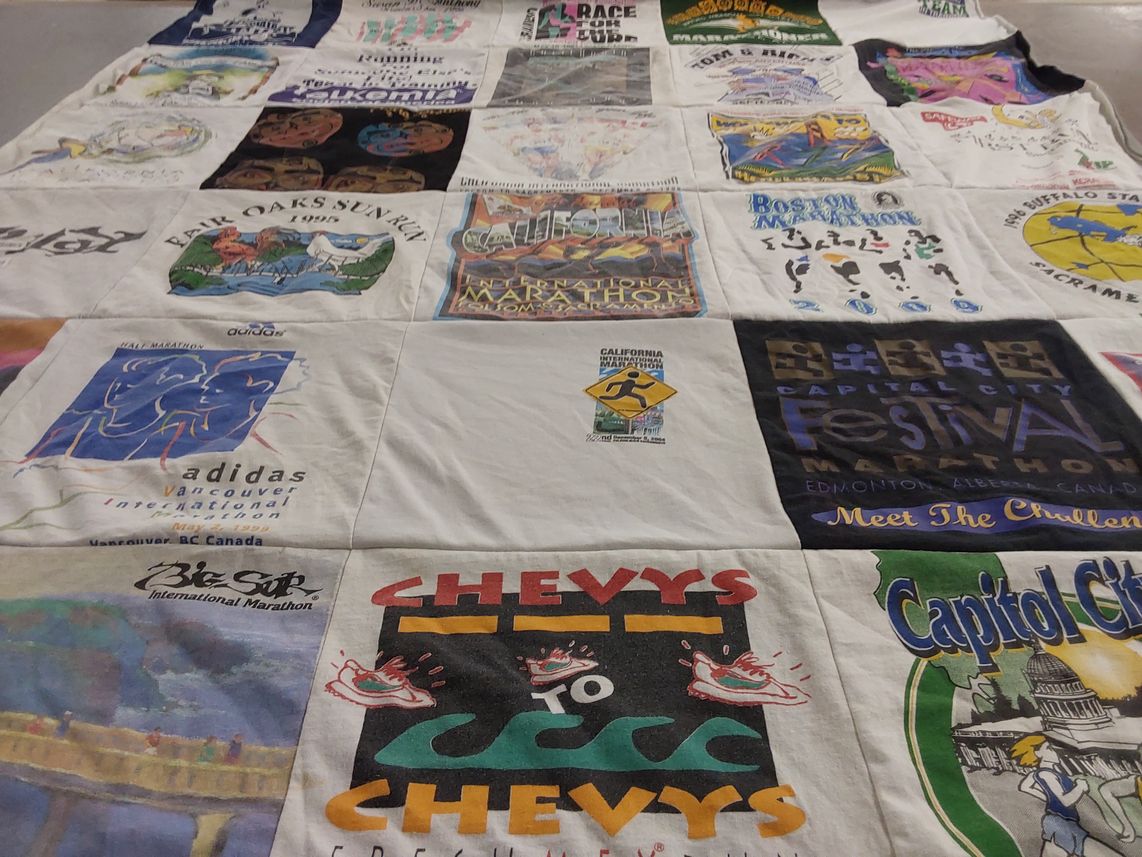 T-shirt quilt with running, sports themes by Donna from CA