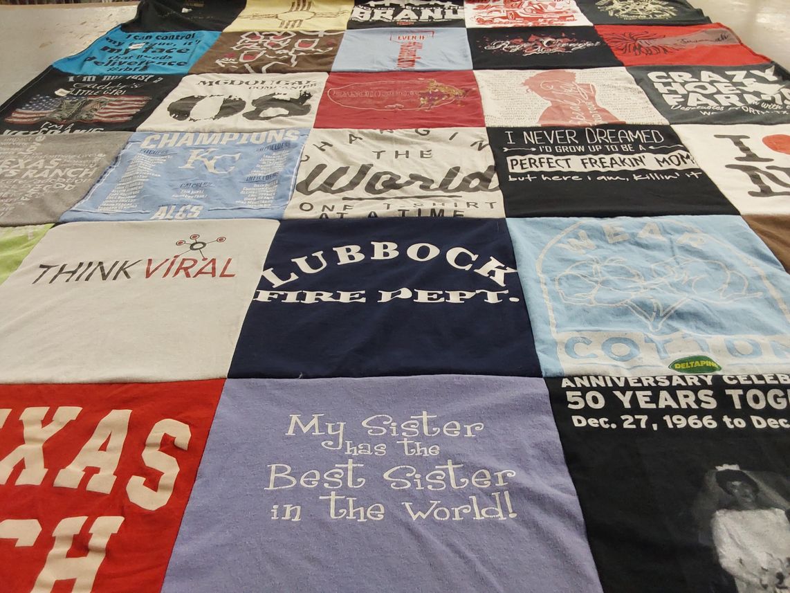 T-shirt quilt with family, community themes by SHAULA from NM