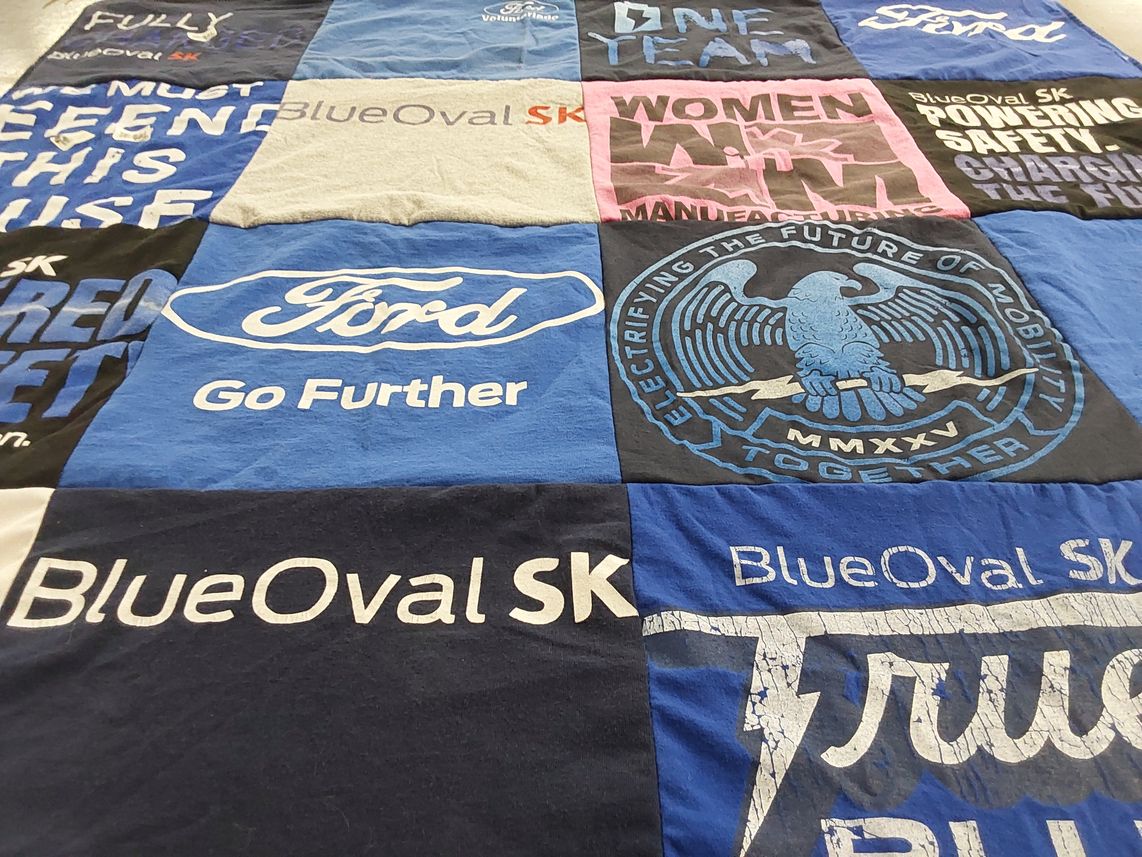 T-shirt quilt with automotive, manufacturing themes by Jiem from TX