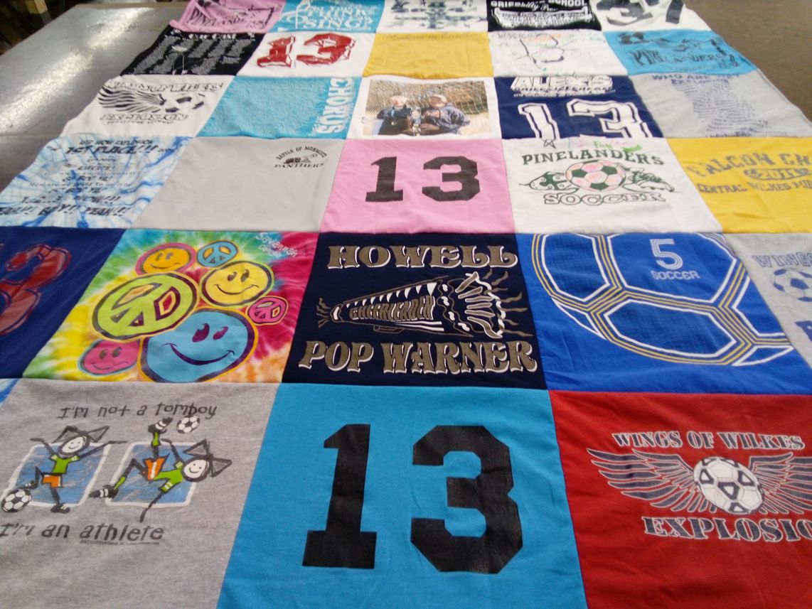 T-shirt quilt featuring wings of wilkes explosion, pinelanders soccer by Denise from NC