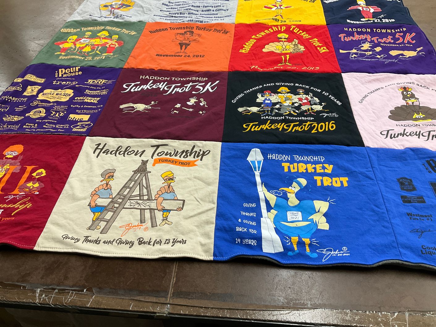 T-shirt quilt with running, community events themes by Amelia from NJ