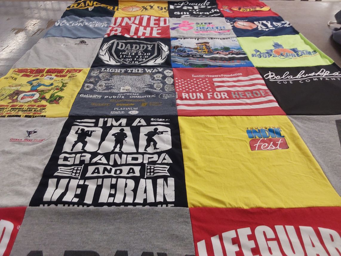 T-shirt quilt with music, community themes by Gilbert from NC
