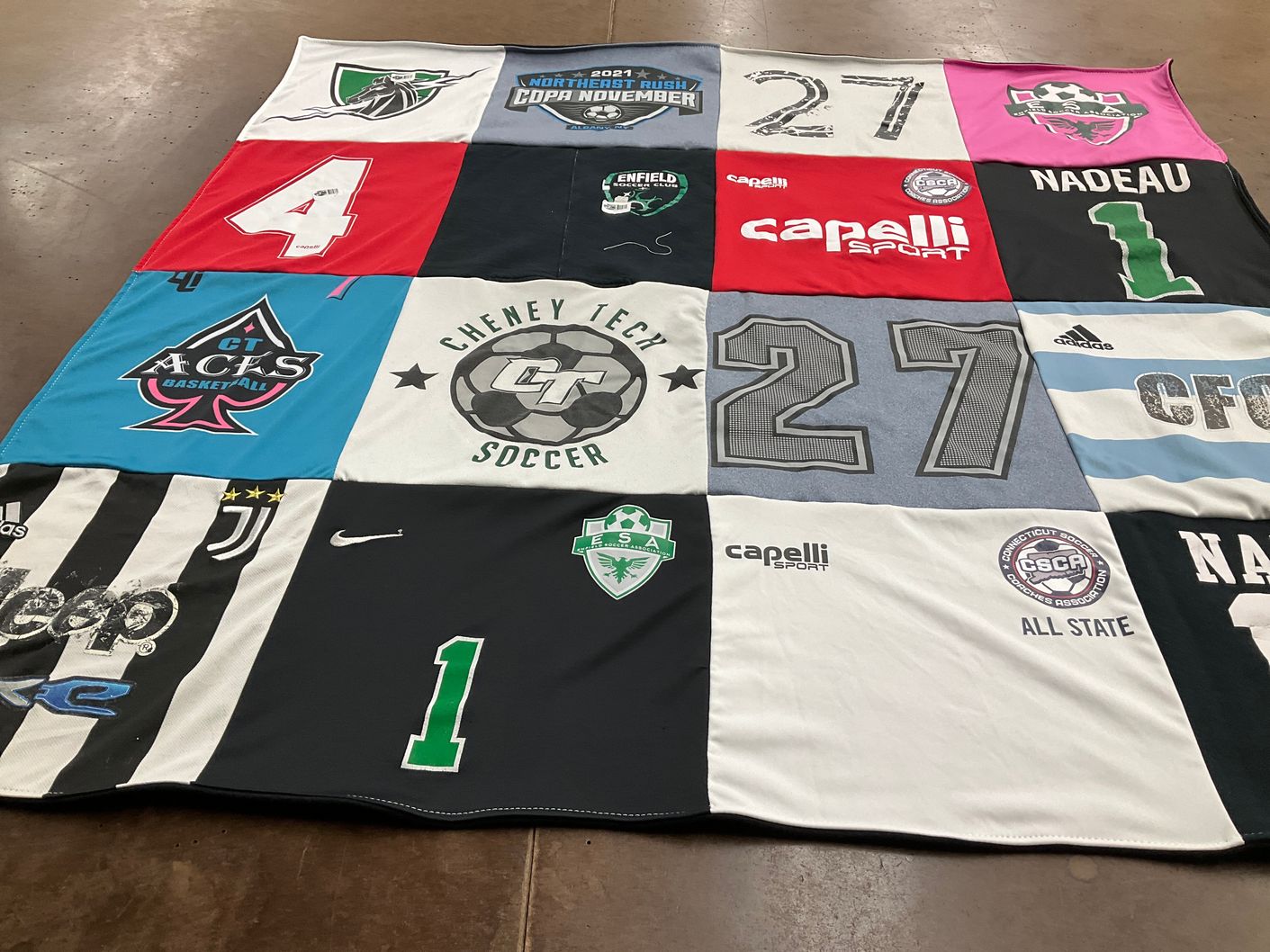 T-shirt quilt featuring connecticut acks, cheney tech varsity soccer by Trishia from CT