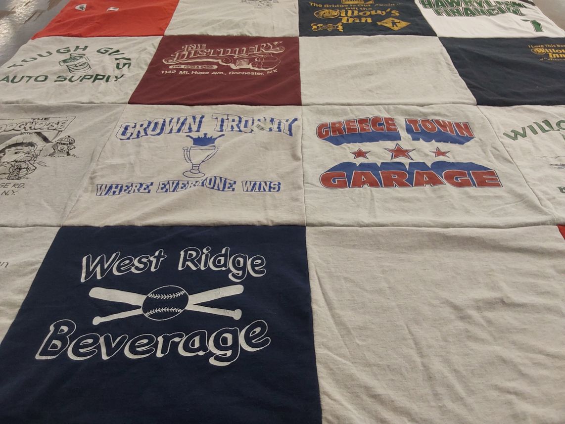 T-shirt quilt with local businesses, beverages themes by Karen from NY
