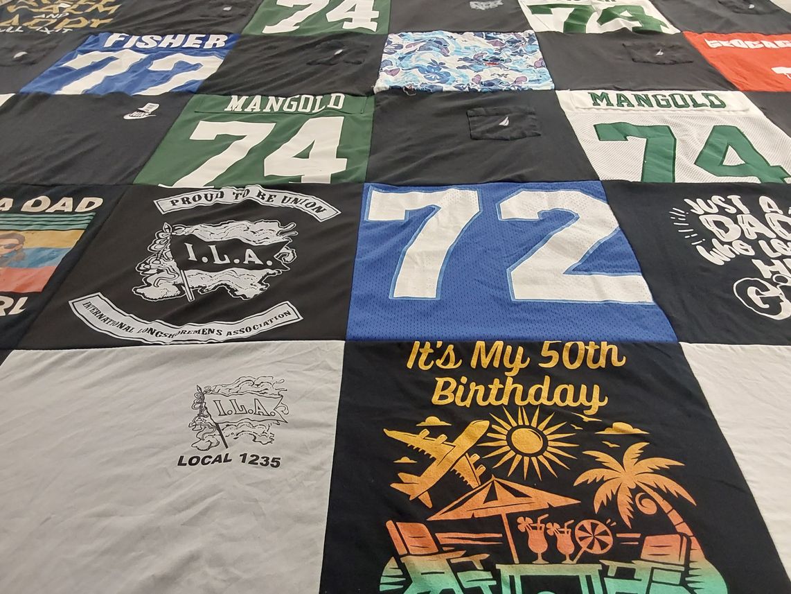 T-shirt quilt with celebration, union work themes by Erika from NJ