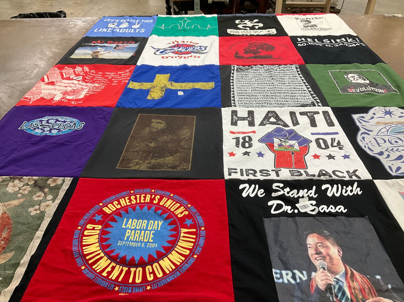 T-shirt quilt with community, labor rights themes by Maria from NY