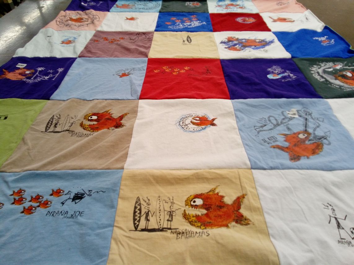 T-shirt quilt with travel, ocean themes by Dionette from WI