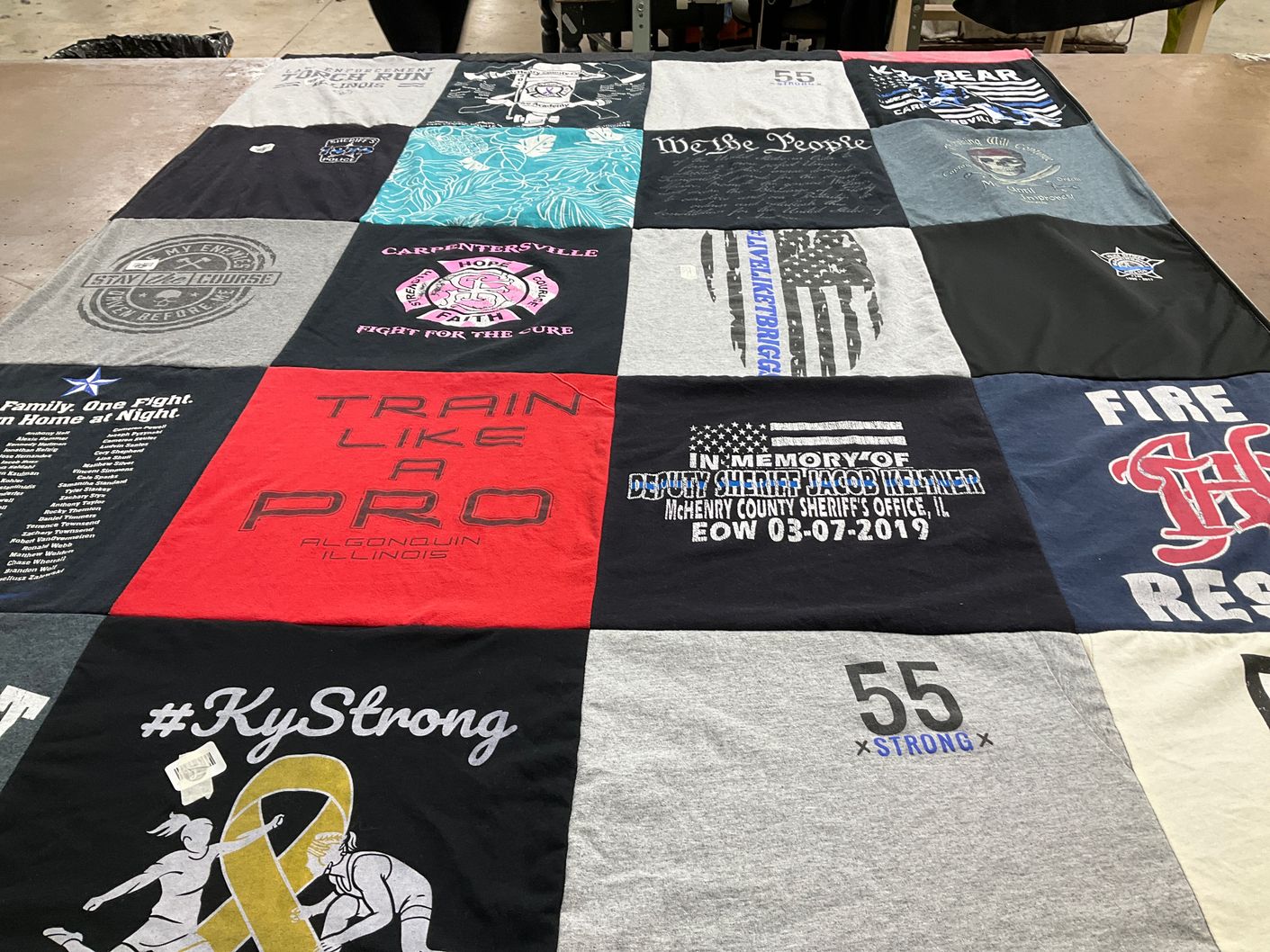 T-shirt quilt with fitness, community themes by Kara from IL