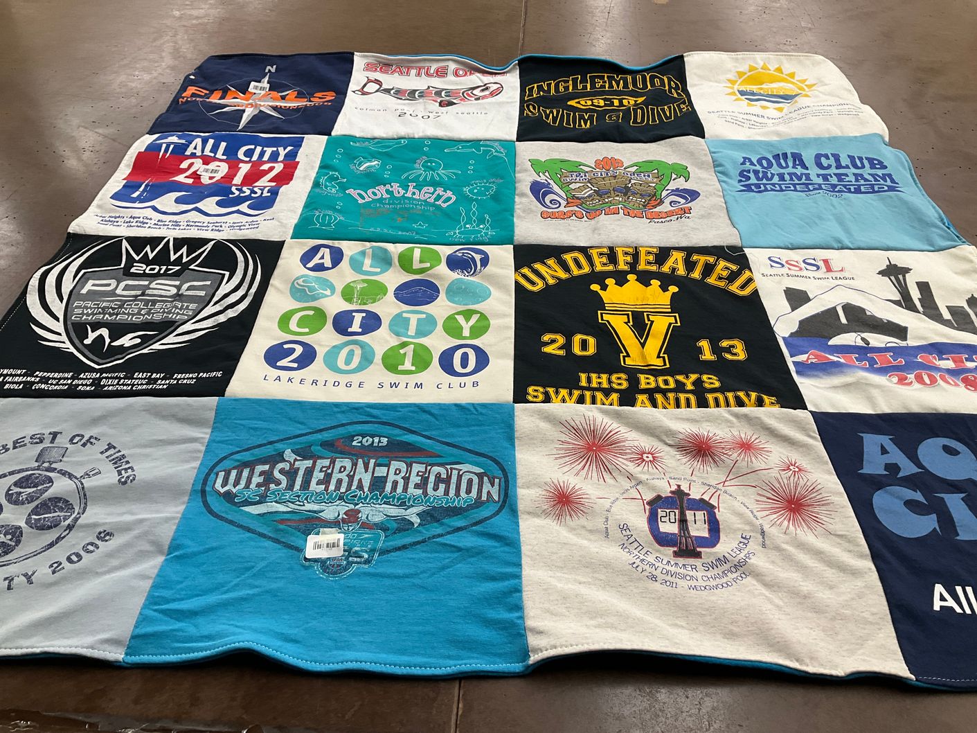 T-shirt quilt featuring ihs boys swim and dive, lakeridge swim club by Megan from WA