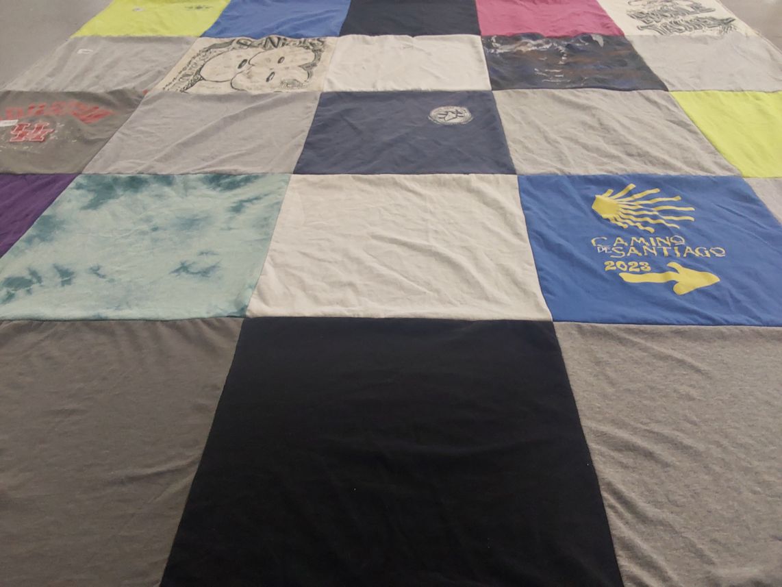 T-shirt quilt with travel, pilgrimage themes by Alicia from LA
