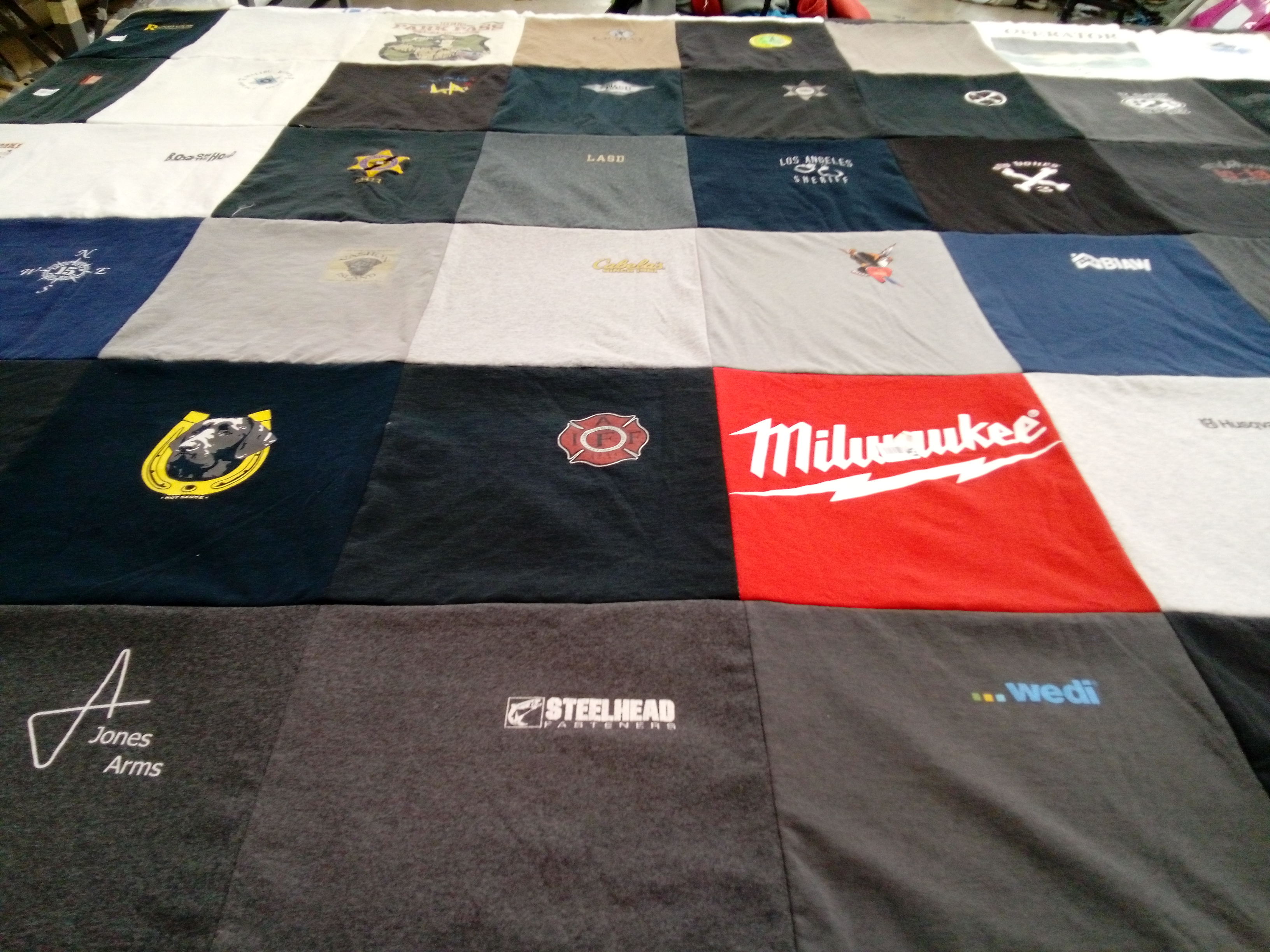 T-shirt quilt with construction, fishing themes by kevin from WA