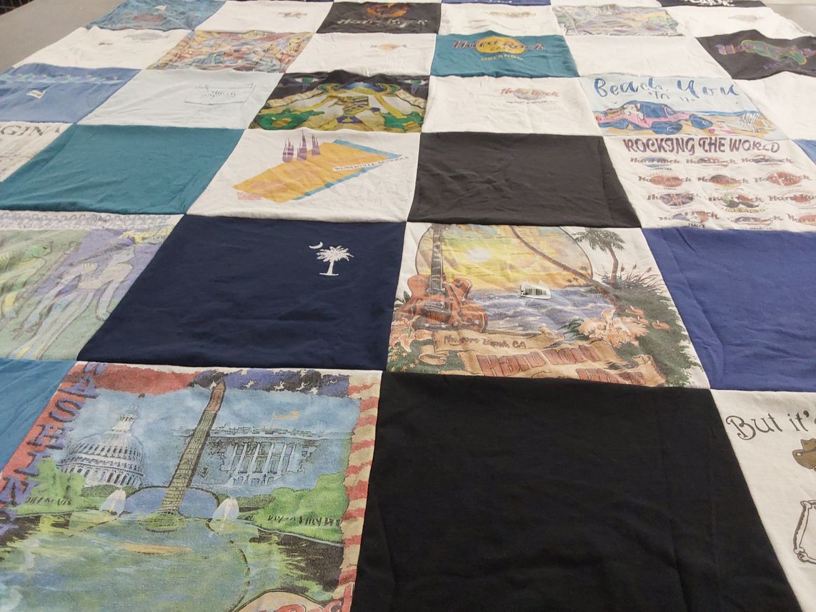 T-shirt quilt with travel, music themes by Sheila from NC