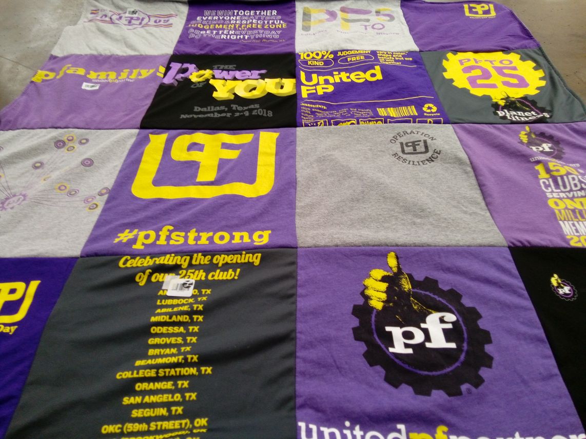 T-shirt quilt with community, teamwork themes by Tracy from TX