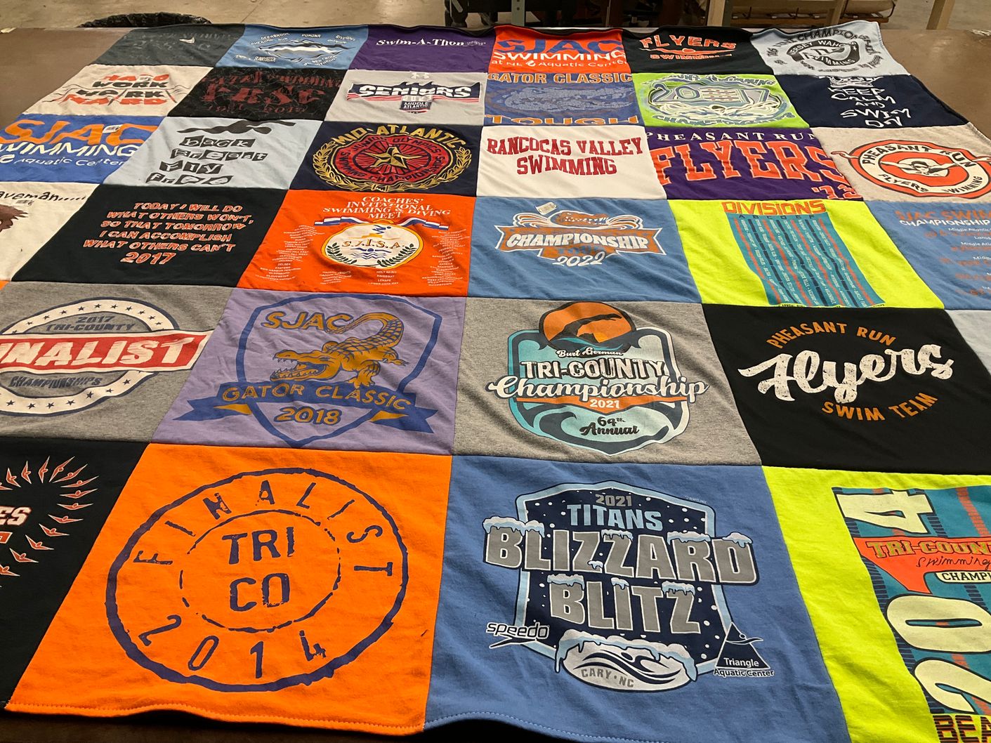 T-shirt quilt featuring flyers swim team, titans swim team by Susan from NJ