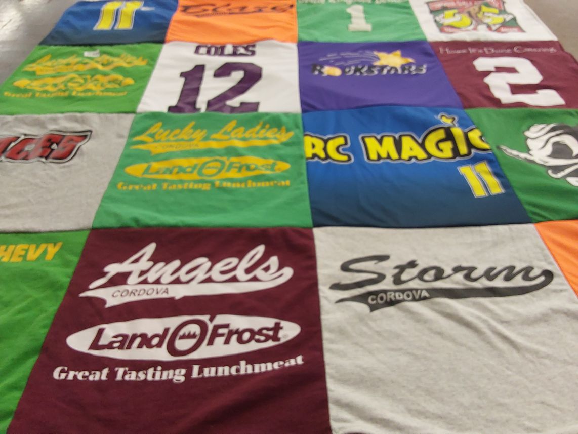 T-shirt quilt with sports, dancing themes by Sarah from CA