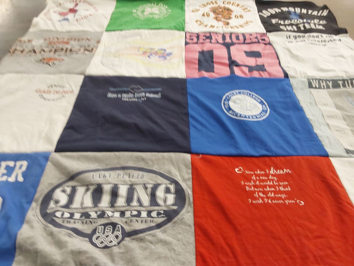 T-shirt quilt with skiing, cross country themes by Rebecca from CO