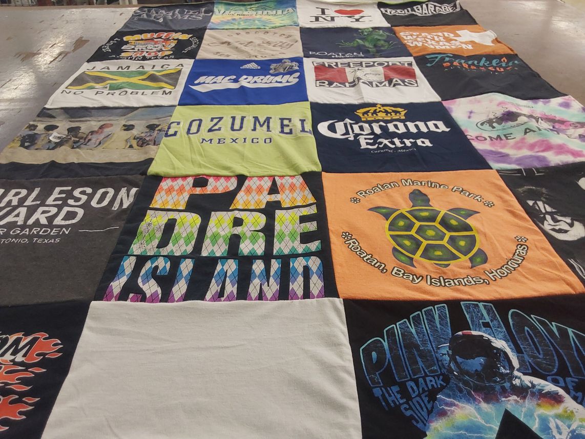 T-shirt quilt with travel, music themes by Amy from TX