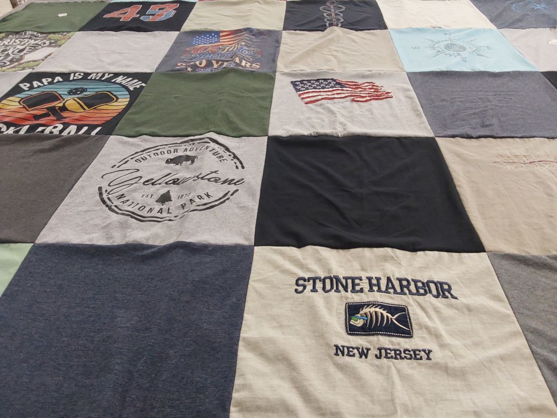 T-shirt quilt with outdoor adventure themes by Diane from PA
