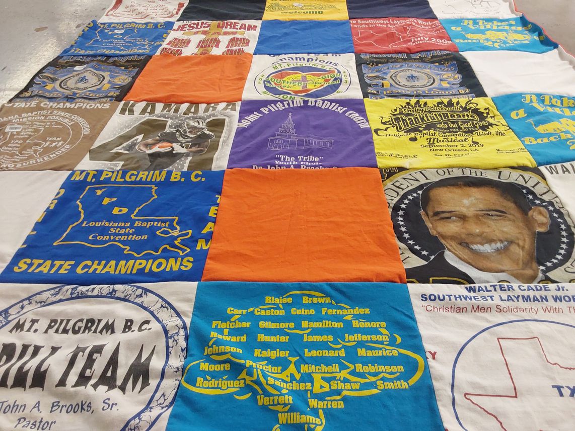 T-shirt quilt with religion, sports themes by Velma from LA