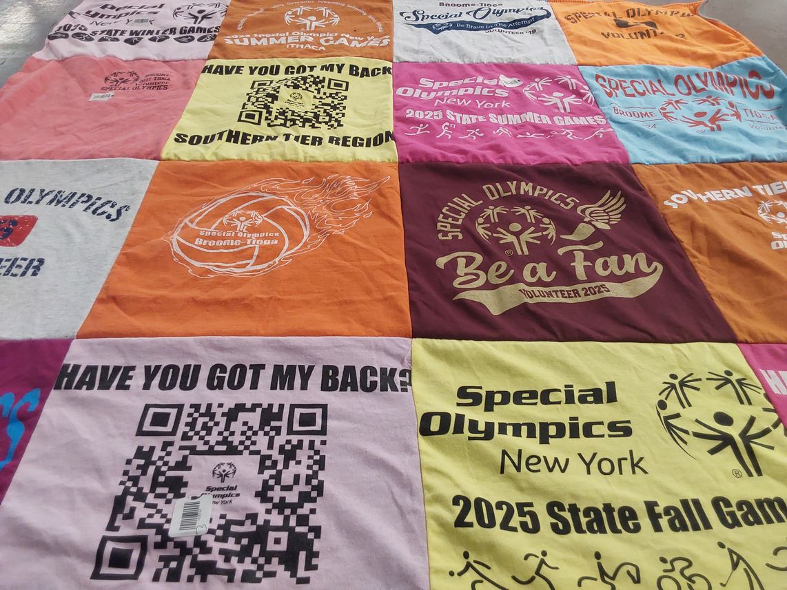 T-shirt quilt with volunteering, sports themes by Tammy from NY