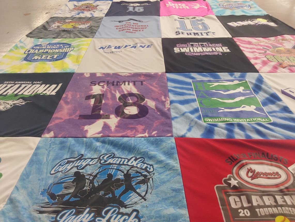 T-shirt quilt with swimming, sports themes by Cindy from NY