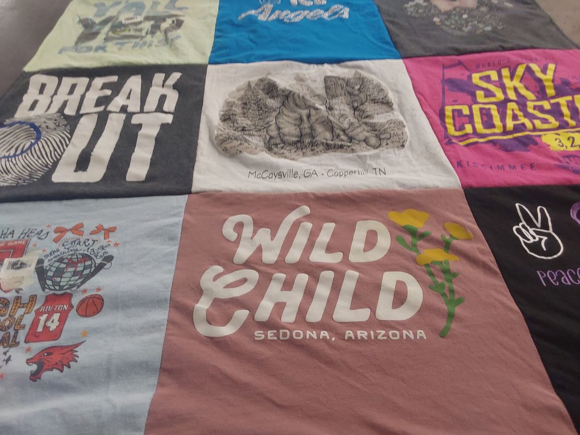 T-shirt quilt with travel, adventure themes by Alexa from OH