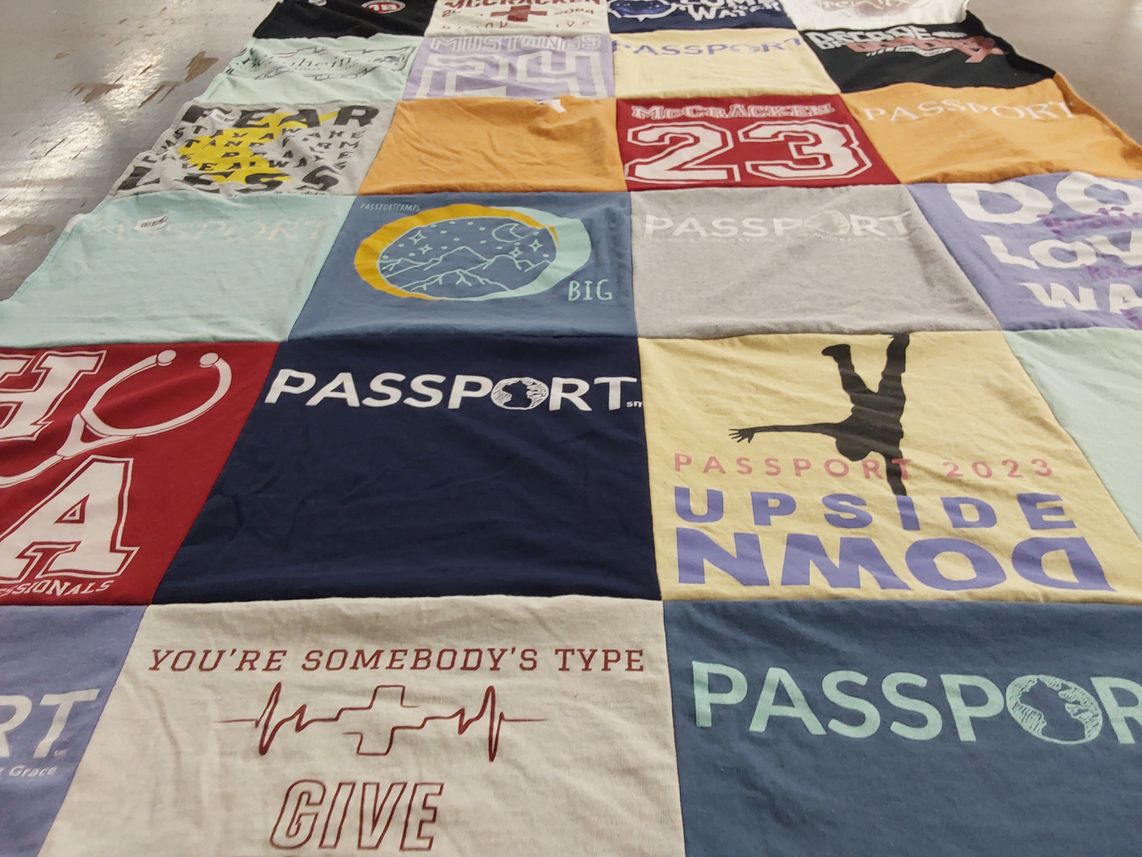 T-shirt quilt with community service, travel themes by Lesley from KY