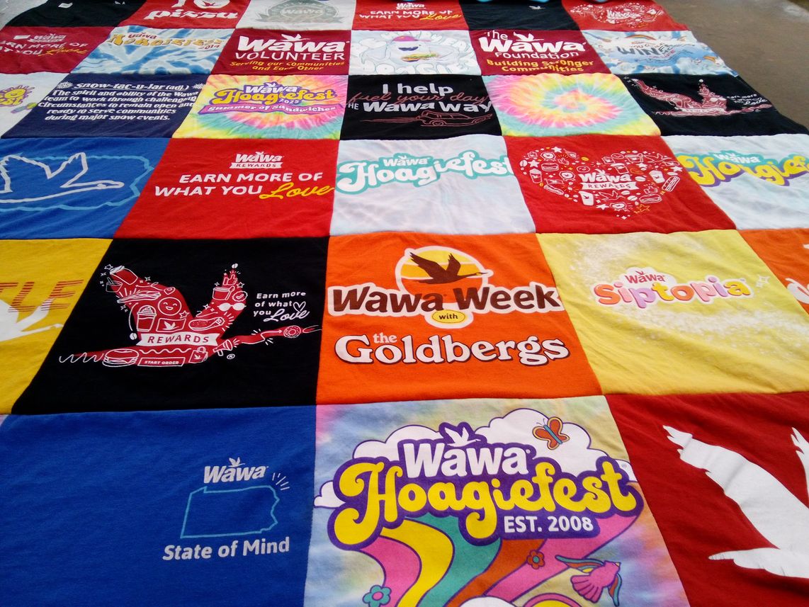 T-shirt quilt with food, community service themes by Karin from PA