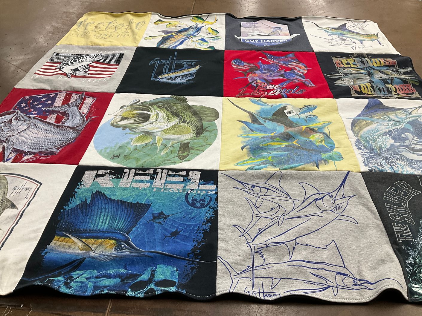 T-shirt quilt with fishing, marine life themes by Cindy from FL