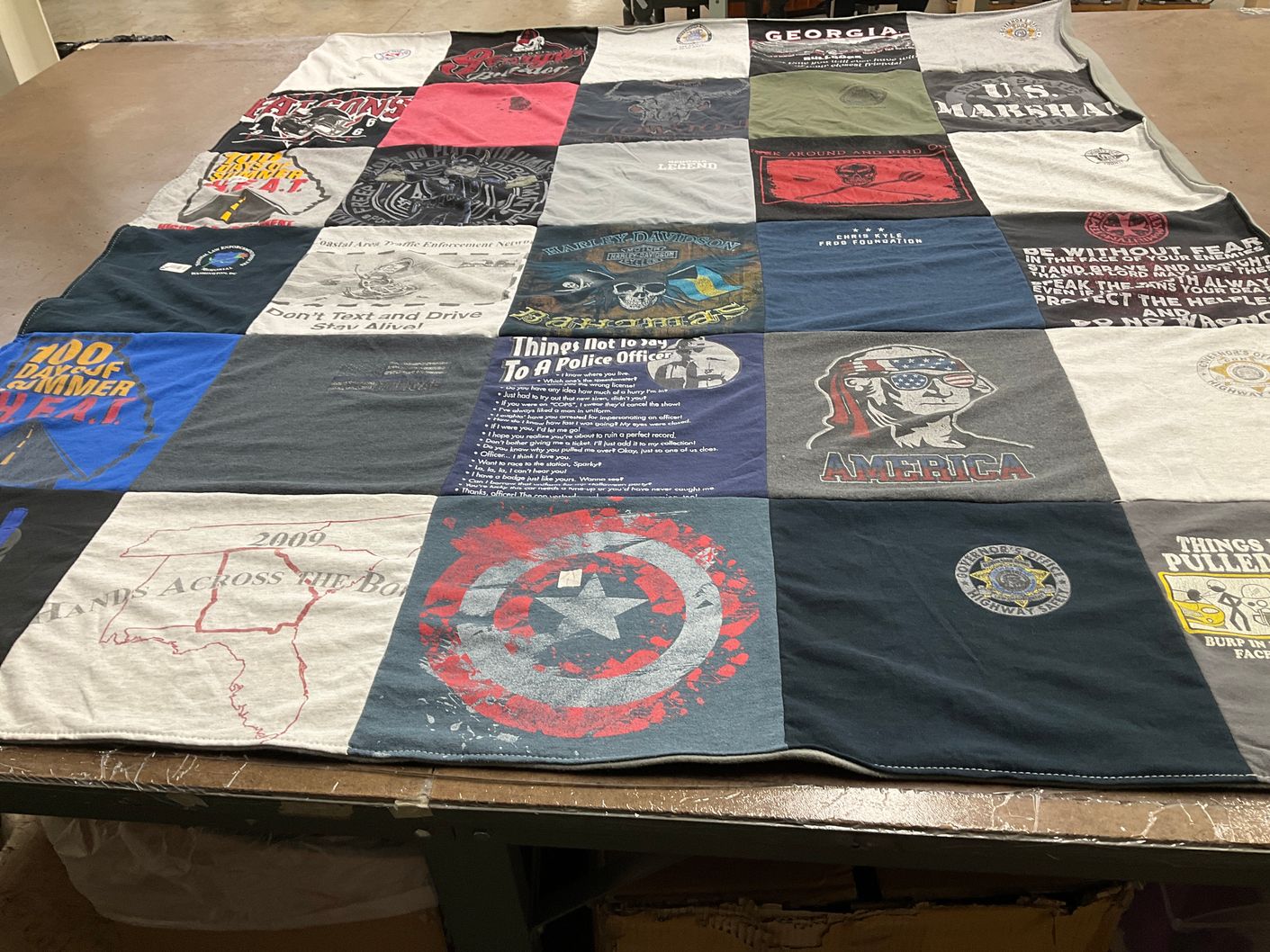 T-shirt quilt with law enforcement, community awareness themes by Kristie from GA