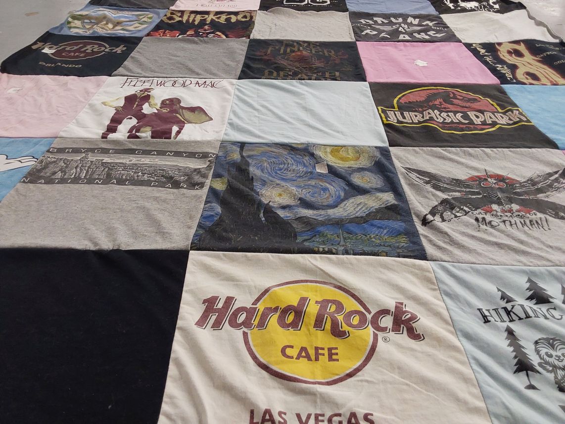 T-shirt quilt with music, travel themes by April from OH