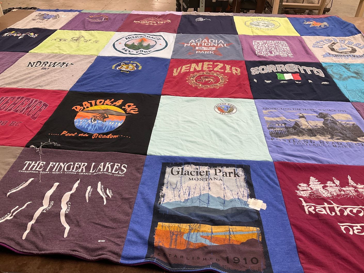 T-shirt quilt with traveling, outdoor activities themes by Christine from CA